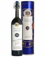 Blå gavetube med guldtryk og slank flaske Grappa di Sassicaia fra Poli